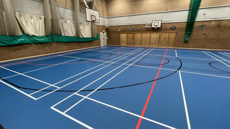 School in Bolton gets new PU sports floor in blue and fresh line / court markings